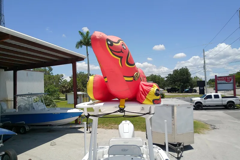 Slide: The Image of 2025 Glasstream 240 CCX with inflatable duck on top, parked outdoors. - 44