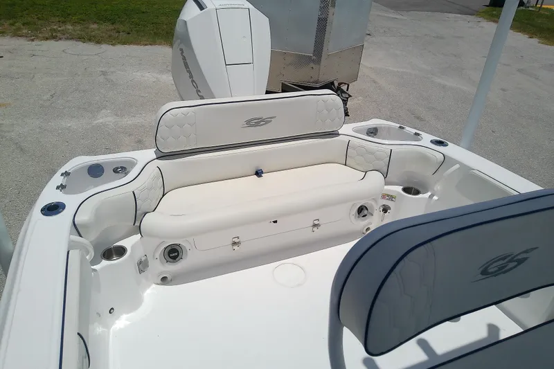 Slide: The Image of 2025 Glasstream 240 CCX boat interior with cushioned seating and modern design. - 9