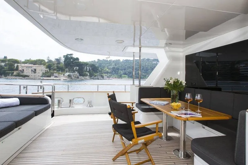 Slide: The Image of Luxurious 2014 Fifth Ocean Yachts 24m Explorer Yacht with elegant outdoor seating and scenic views. - 87