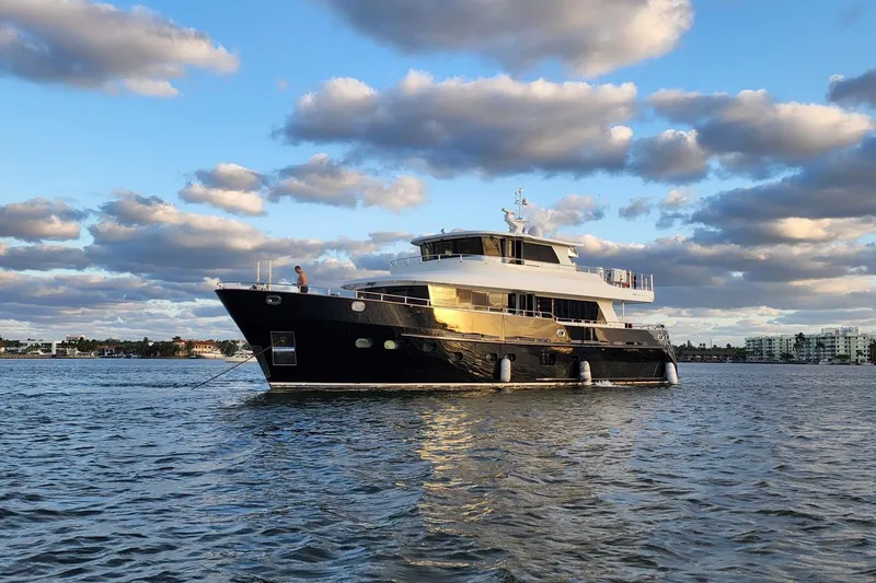 Slide: The Image of 2014 Fifth Ocean Yachts 24m Displacement Explorer Yacht on calm water under cloudy sky. - 1