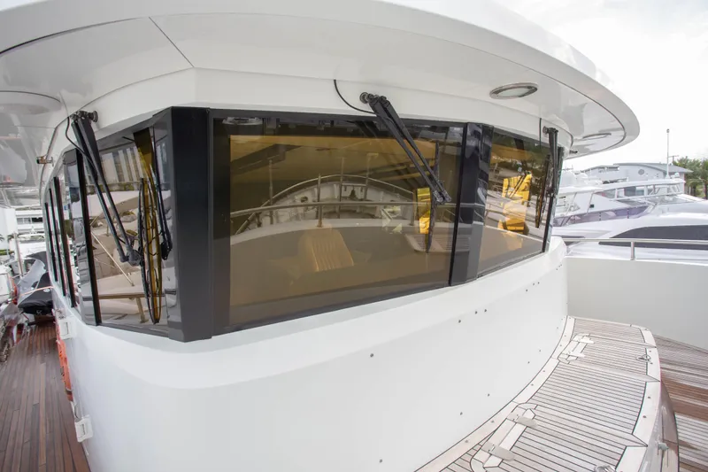 Slide: The Image of 2014 Fifth Ocean Yachts 24m Displacement Explorer Yacht, featuring sleek windows and deck. - 14