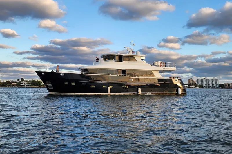 Slide: The Image of 2014 Fifth Ocean Yachts 24m Displacement Explorer Yacht on calm water under cloudy sky. - 2