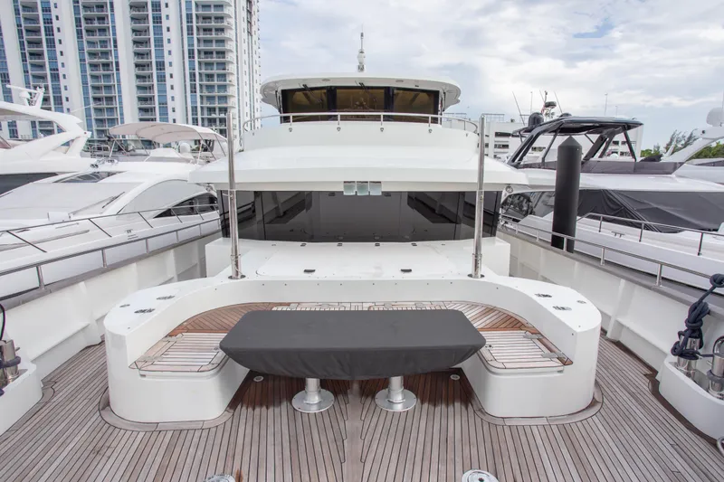Slide: The Image of Luxurious 2014 Fifth Ocean Yachts 24m Explorer Yacht docked, showcasing spacious deck and modern design. - 21