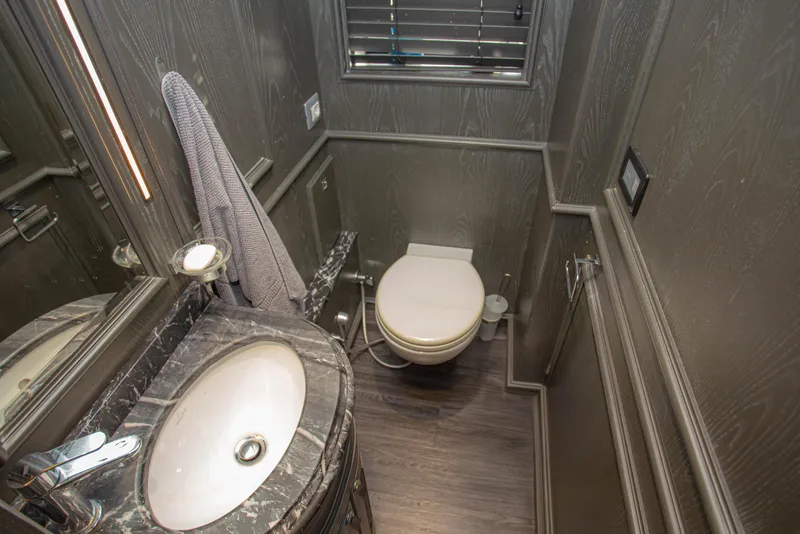 Slide: The Image of Luxurious bathroom on 2014 Fifth Ocean Yachts 24m Explorer Yacht with marble sink and modern fixtures. - 33