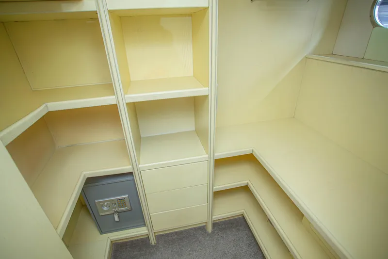Slide: The Image of Interior storage space with shelves and safe on 2014 Fifth Ocean Yachts Explorer. - 45