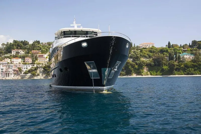 Slide: The Image of Luxurious 2014 Fifth Ocean Yachts 24m Explorer Yacht on serene coastal waters. - 94