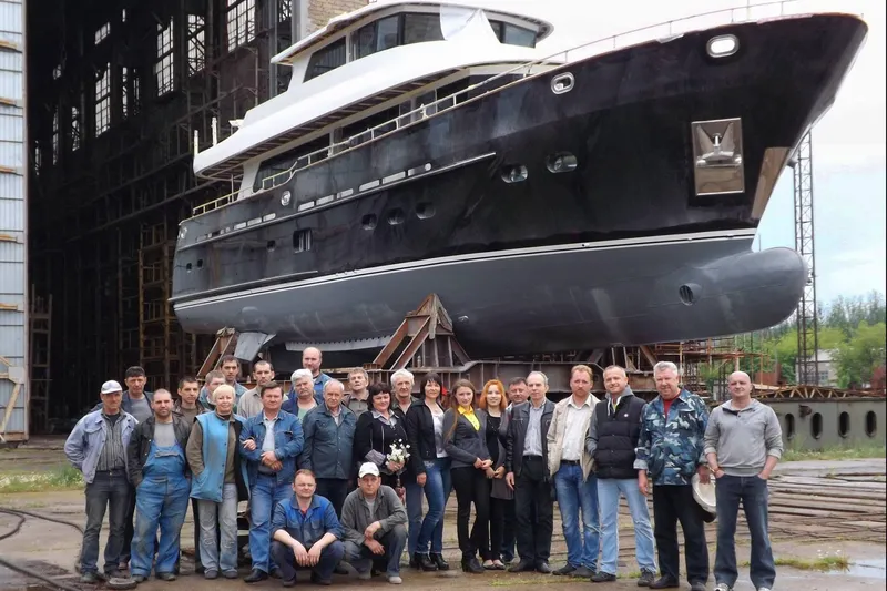 Slide: The Image of Group in front of 2014 Fifth Ocean Yachts 24m Displacement Explorer Yacht in shipyard. - 105