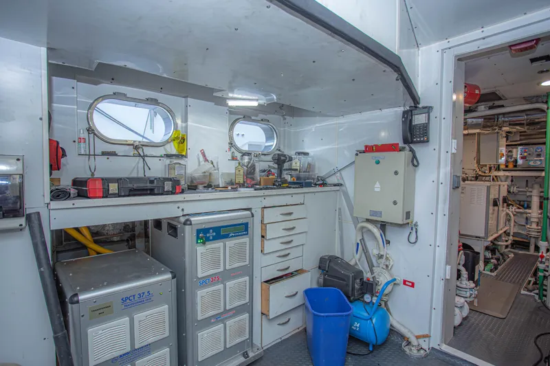 Slide: The Image of Engine room of 2014 Fifth Ocean Yachts 24m Explorer Yacht, featuring equipment and storage. - 70