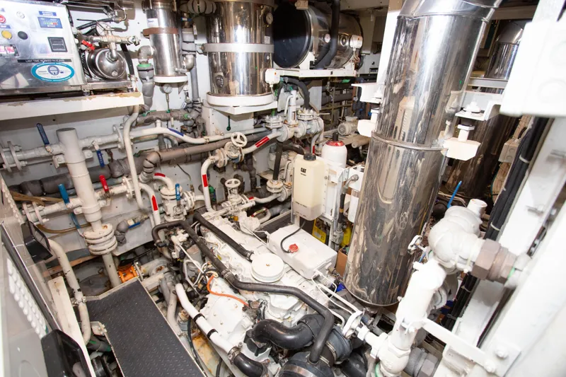 Slide: The Image of Engine room of 2014 Fifth Ocean Yachts 24m Displacement Explorer Yacht, showcasing complex machinery. - 72
