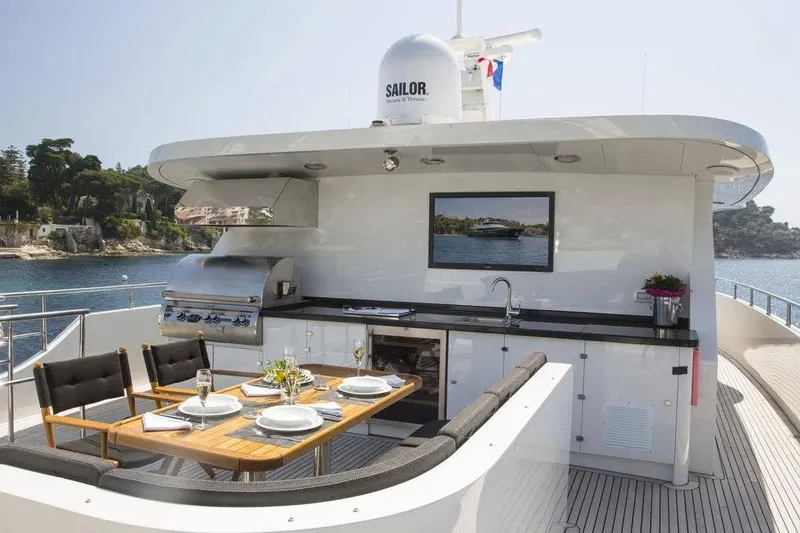 Slide: The Image of Luxurious outdoor dining area on 2014 Fifth Ocean Yachts 24m Explorer Yacht with scenic ocean view. - 88