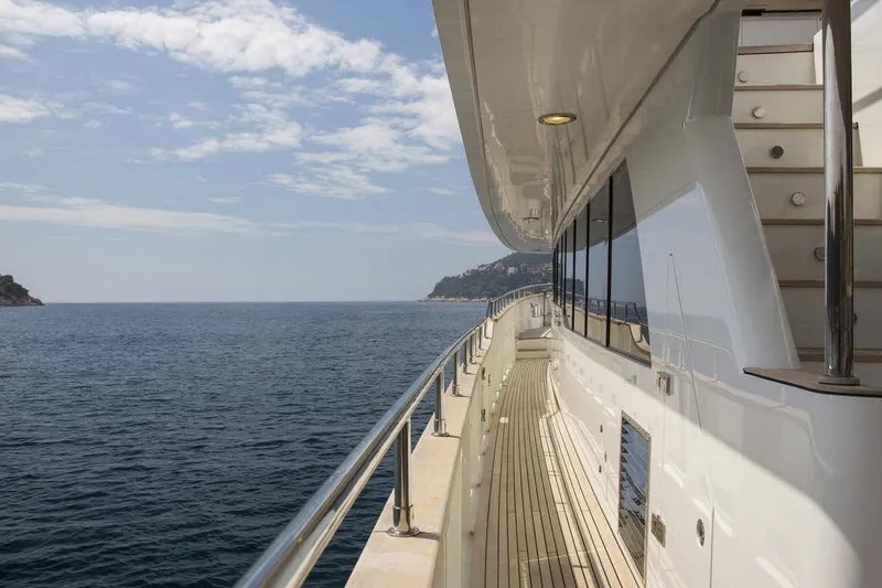 Slide: The Image of Side deck view of 2014 Fifth Ocean Yachts 24m Displacement Explorer Yacht on open sea. - 90