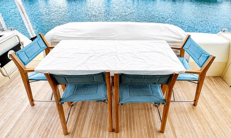 Slide: The Image of Monte Carlo MC6 2019 yacht with table and chairs on deck. - 15