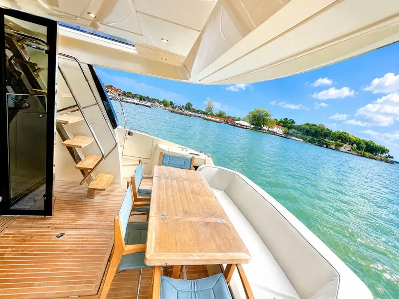 Slide: The Image of Monte Carlo MC6 Yacht 2019 with deck view over water. - 17