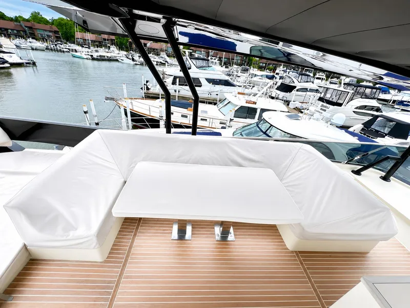 Slide: The Image of Luxurious Monte Carlo MC6 yacht with elegant seating area in harbor. - 27