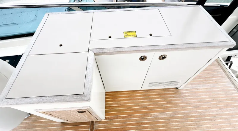 Slide: The Image of Monte Carlo MC6 2019 yacht kitchenette with wooden deck. - 29