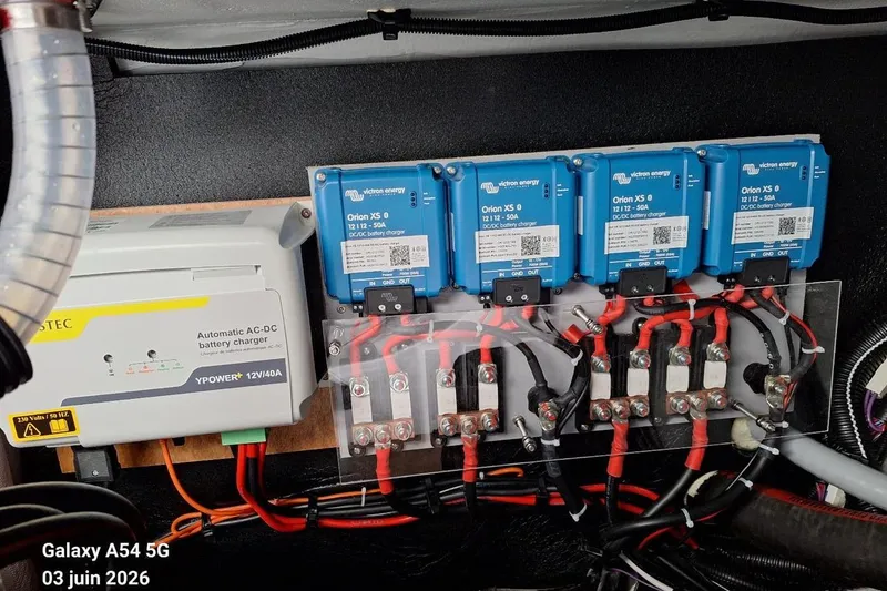 Slide: The Image of Electrical panel inside Excess 14 model, showcasing wiring and components, 2026. - 31