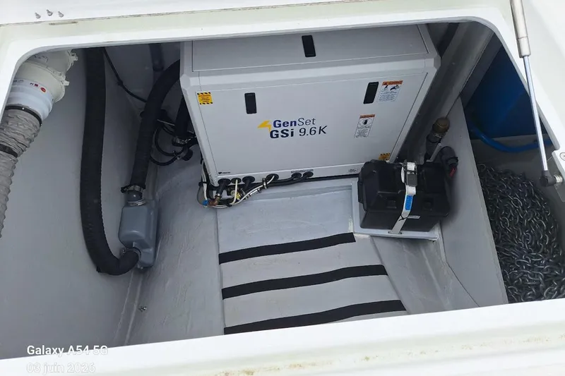 Slide: The Image of Sleek 2026 Excess 14 yacht with solar panels on deck, docked in a marina. - 35