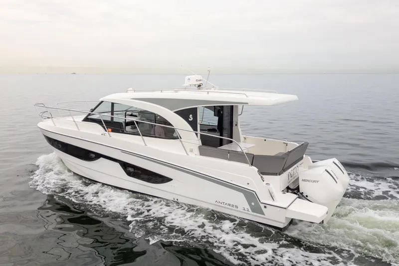 Slide: The Image of 2023 Beneteau Antares 11 cruising on calm waters, showcasing sleek design and modern features. - 10