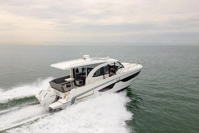 Slide: The Image of 2023 Beneteau Antares 11 cruising on open water, showcasing sleek design and powerful performance. - 16