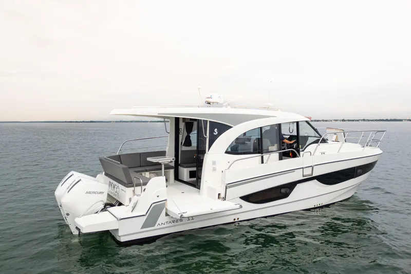 Slide: The Image of 2023 Beneteau Antares 11 boat cruising on calm waters, showcasing sleek design and modern features. - 17