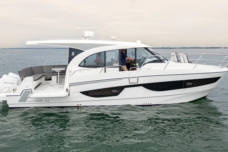 Slide: The Image of 2023 Beneteau Antares 11 boat cruising on calm waters, showcasing sleek design and modern features. - 18