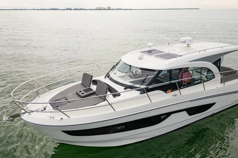 Slide: The Image of 2023 Beneteau Antares 11 yacht cruising on calm waters, showcasing sleek design and modern features. - 20