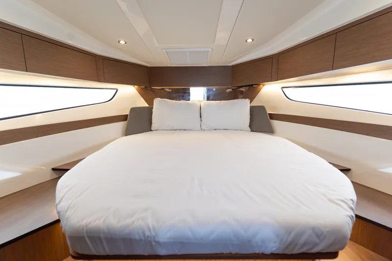 Slide: The Image of Luxurious cabin interior of 2023 Beneteau Antares 11 with cozy bed and modern design. - 28