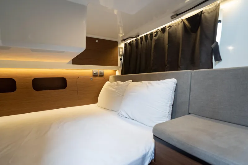 Slide: The Image of Interior cabin of 2023 Beneteau Antares 11, featuring cozy bed and modern design. - 30