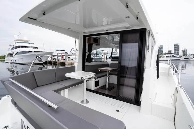 Slide: The Image of 2023 Beneteau Antares 11 yacht with sleek interior and marina view. - 39