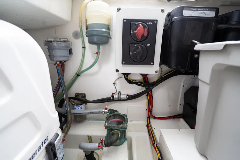 Slide: The Image of Engine compartment of 2023 Beneteau Antares 11, featuring generator controls and wiring. - 43