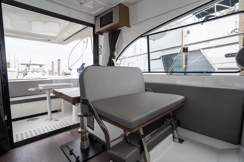 Slide: The Image of Interior view of 2023 Beneteau Antares 11 yacht, featuring modern seating and dining area. - 46