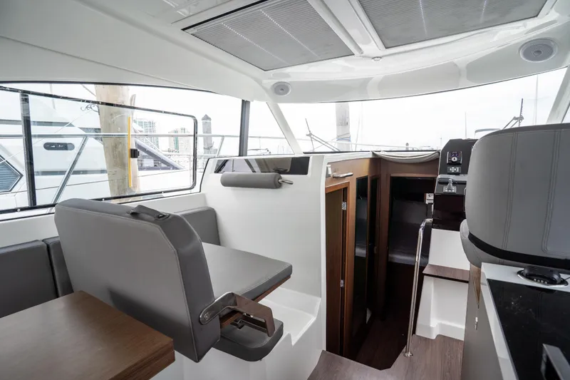 Slide: The Image of Interior of 2023 Beneteau Antares 11, featuring modern seating and sleek design elements. - 47