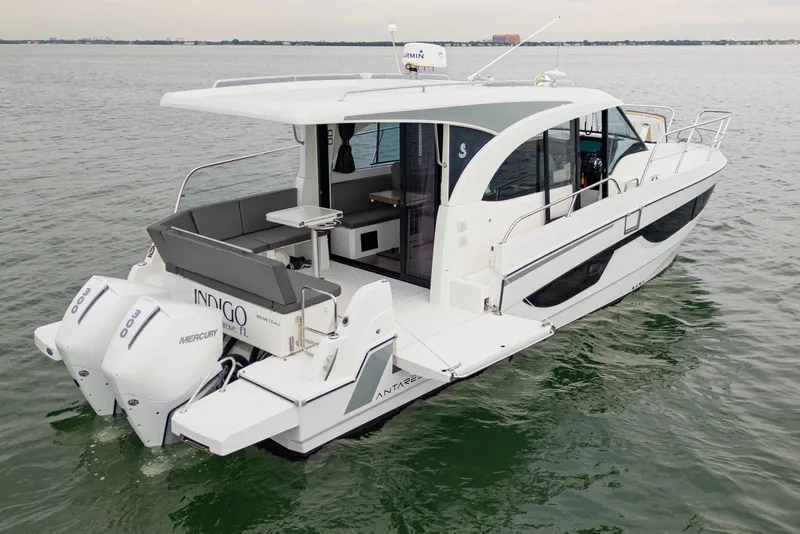 The Image of 2023 Beneteau Antares 11 motorboat on calm water, featuring sleek design and twin Mercury engines. - 6