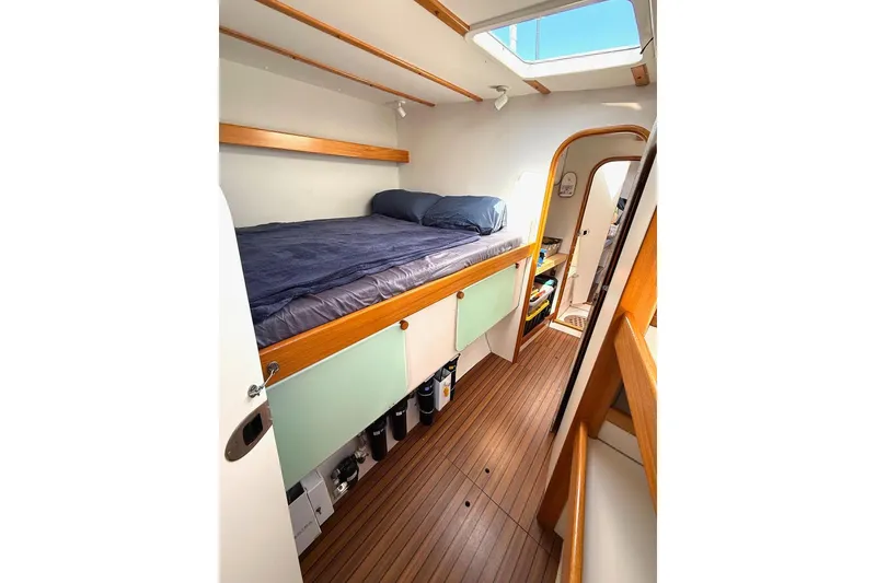 Slide: The Image of Interior of 2004 Outremer Standard yacht cabin with bed and wooden flooring. - 14