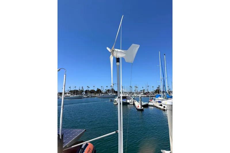 Slide: The Image of Wind turbine on 2004 Outremer Standard yacht docked in sunny marina. - 8