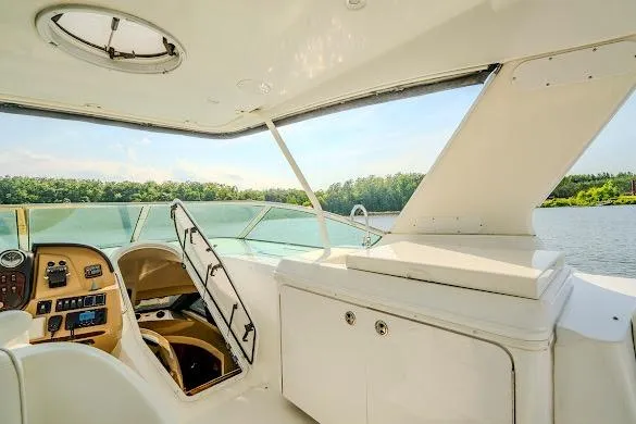 Slide: The Image of Interior view of 2003 Carver 570 Voyager Pilothouse yacht with scenic water backdrop. - 30