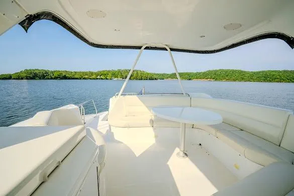 Slide: The Image of Luxurious 2003 Carver 570 Voyager Pilothouse yacht interior with scenic water view. - 36