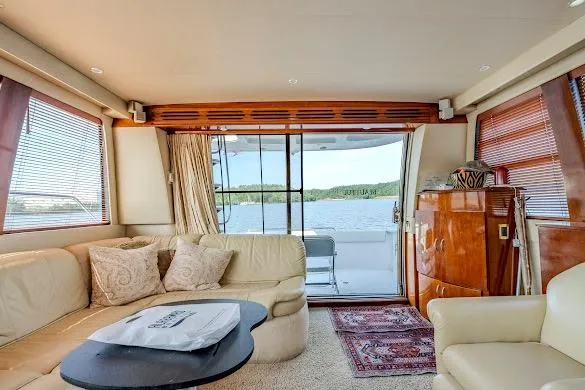 Slide: The Image of Luxurious interior of 2003 Carver 570 Voyager Pilothouse yacht with lake view. - 40