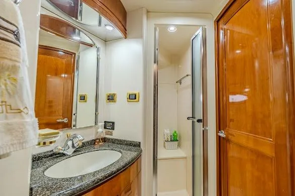 Slide: The Image of Luxurious bathroom in 2003 Carver 570 Voyager Pilothouse yacht with granite countertop and shower. - 68