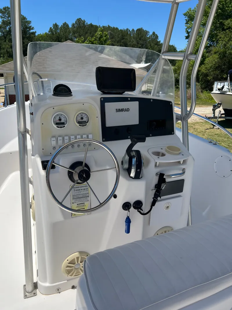 Slide: The Image of 2004 Pro-Line 20 Sport boat console with Simrad system. - 11