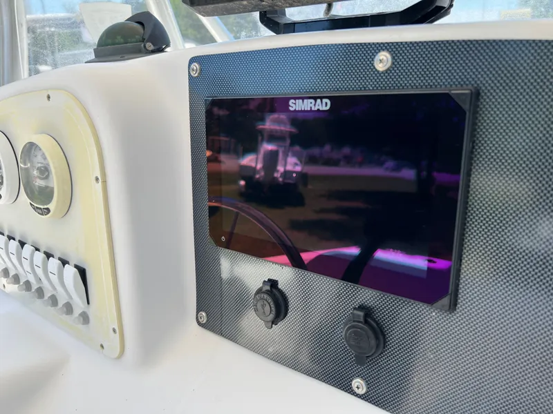 Slide: The Image of Dashboard of a 2004 Pro-Line 20 Sport boat with Simrad display. - 15