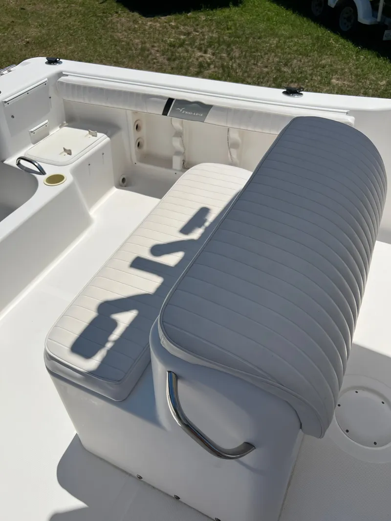 Slide: The Image of Interior of a 2004 Pro-Line 20 Sport boat with white seating. - 18