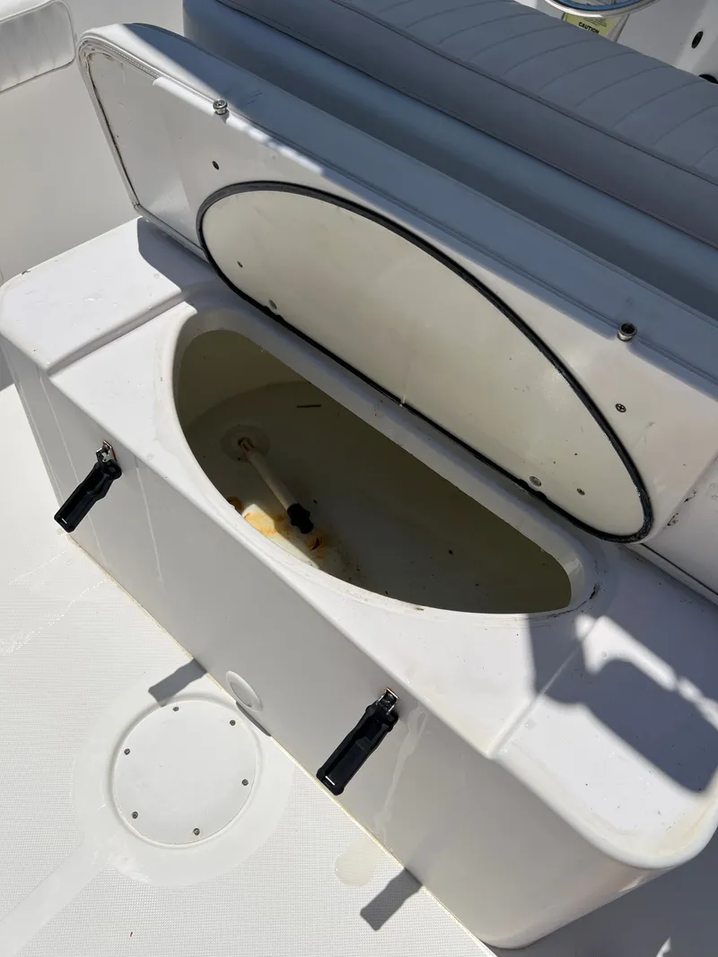 Slide: The Image of Open storage compartment on a 2004 Pro-Line 20 Sport boat. - 19