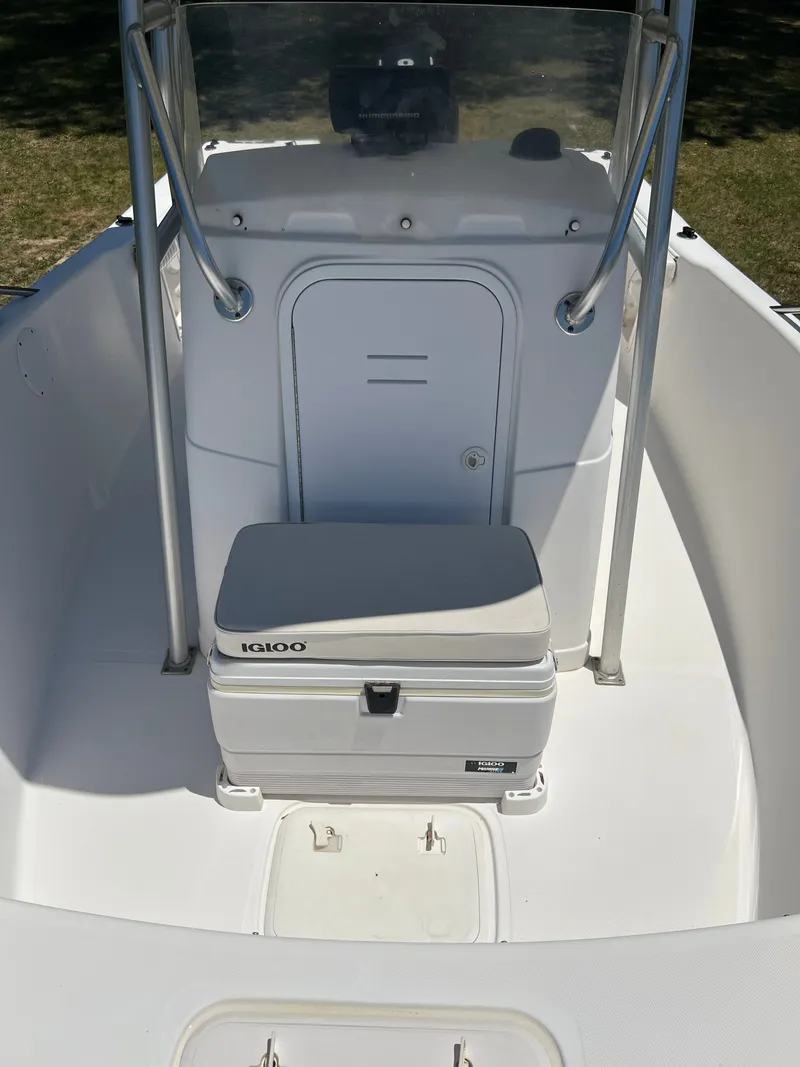 Slide: The Image of Interior of a 2004 Pro-Line 20 Sport boat with Igloo cooler. - 22