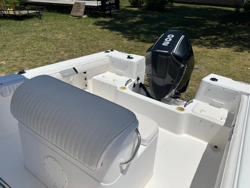 Slide: The Image of Interior view of a 2004 Pro-Line 20 Sport boat with Mercury engine. - 6
