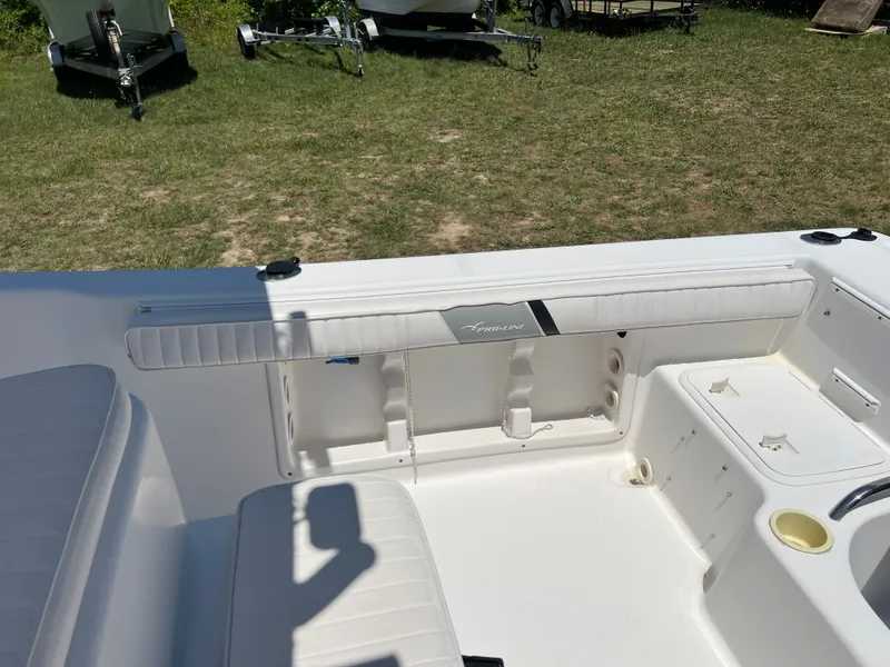 Slide: The Image of Interior of a 2004 Pro-Line 20 Sport boat on grass. - 7