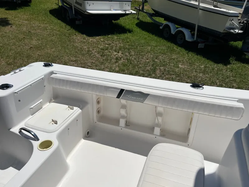 Slide: The Image of Interior of a 2004 Pro-Line 20 Sport boat on grass. - 8