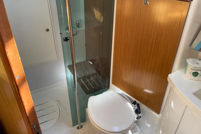 Slide: The Image of Bathroom interior of 2008 Jeanneau Sun Odyssey 39i yacht, featuring shower and toilet. - 12