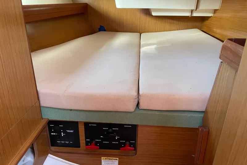 Slide: The Image of Interior cabin of 2008 Jeanneau Sun Odyssey 39i sailboat with twin beds and control panel. - 13