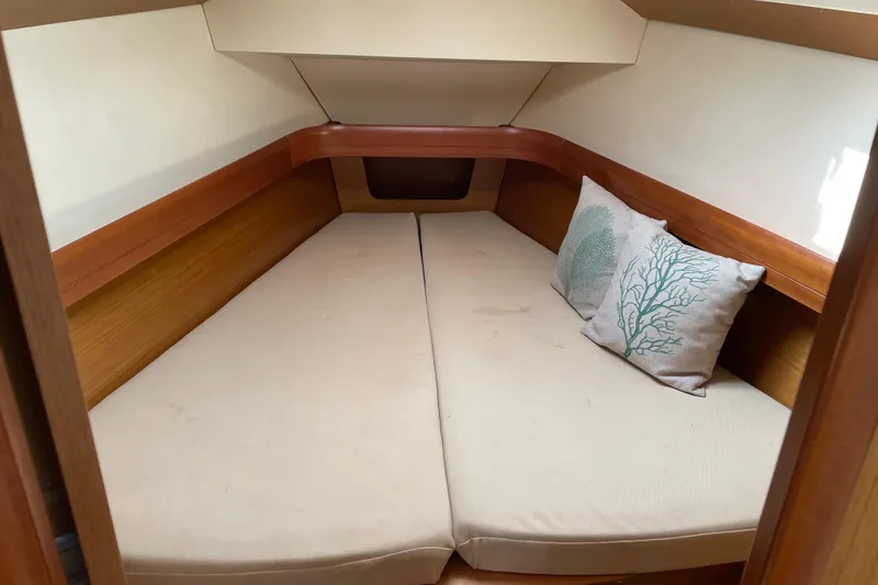 Slide: The Image of Cozy cabin interior of 2008 Jeanneau Sun Odyssey 39i with decorative pillows. - 7